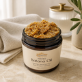 Jar of Batana Oil with a decorative background
