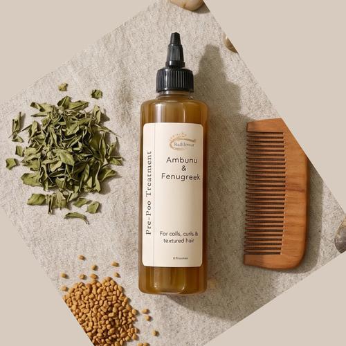 Hair treatment bottle with ingredients and a comb on a textured surface